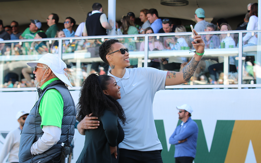 Mercury star Brittney Griner, right, attended the WM Phoenix Open with her wife, Cherelle, It was one of just two public appearances since she was released from a Russian prison in December. (Photo by Matt Venezia/Cronkite News)