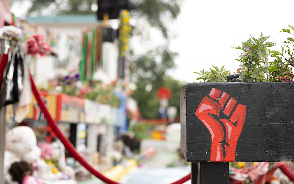 A fist painted on a garden at George Floyd Square, Thursday, July 7, 2022 in Minneapolis, Minnesota. (Photo by Diannie Chavez/News21)