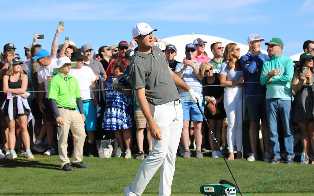 Phoenix Open winner Scottie Scheffler watches the trajectory of his shot Saturday. Most if his went in a positive direction and he pocketed $3.6 million. (Photo by Matt Venezia/Cronkite News)