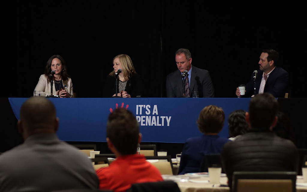 From left, hospitality leaders Eliza McCoy, Rose Walz, Mark VanBeest and Jay Caiafa speak during a panel on hospitality safety at the It’s a Penalty event. McCoy is vice president of prevention and awareness programs for the American Hotel & Lodging Association Foundation; Walz is director of human resources at Arizona Biltmore, a Waldorf Astoria Resort; VanBeest is vice president of external affairs & brand services, G6 Hospitality; and Caiafa is chief operating officer, Americas, IHG Hotels & Resorts. (Photo by Paula Soria/Cronkite News)