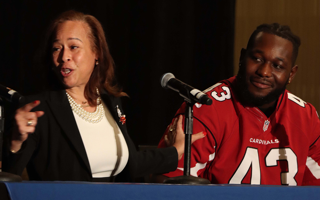Collette V. Smith, who was the first Black woman to coach in the NFL, and Arizona Cardinals player Jesse Luketa speak as part of a panel at the It’s a Penalty event in Phoenix Jan. 25, 2023. (Photo by Paula Soria/Cronkite News)