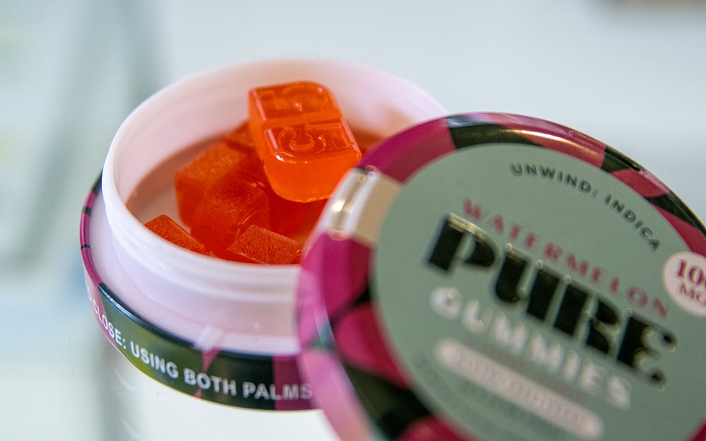 Arizona law prohibits edibles from being designed to look like children’s candies, such as gummy bears. In a licensed Arizona dispensary, marijuana gummies for adults are labeled with the specific dose on individual gummies and their container. State law requires that edibles are limited to a maximum of 10mg of THC per edible and a maximum of 100mg of THC per package of edibles. Photo taken in Scottsdale on Jan. 31, 2023. (Photo by Emily Mai/Cronkite News)