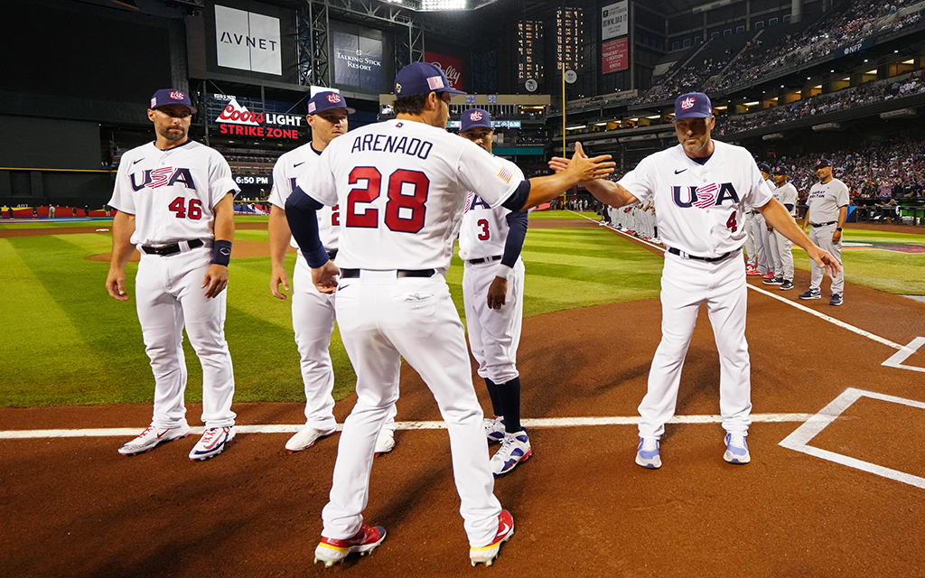 St. Louis Cardinals third baseman Nolan Arenado greets Team USA manager Mark DeRosa, right, and fellow teammate Paul Goldschmidt, left, before Saturday night's matchup against Great Britain. Team USA will take on Team Canada on Monday night. (Photo by Daniel Shirey/WBCI/MLB Photos via Getty Images)