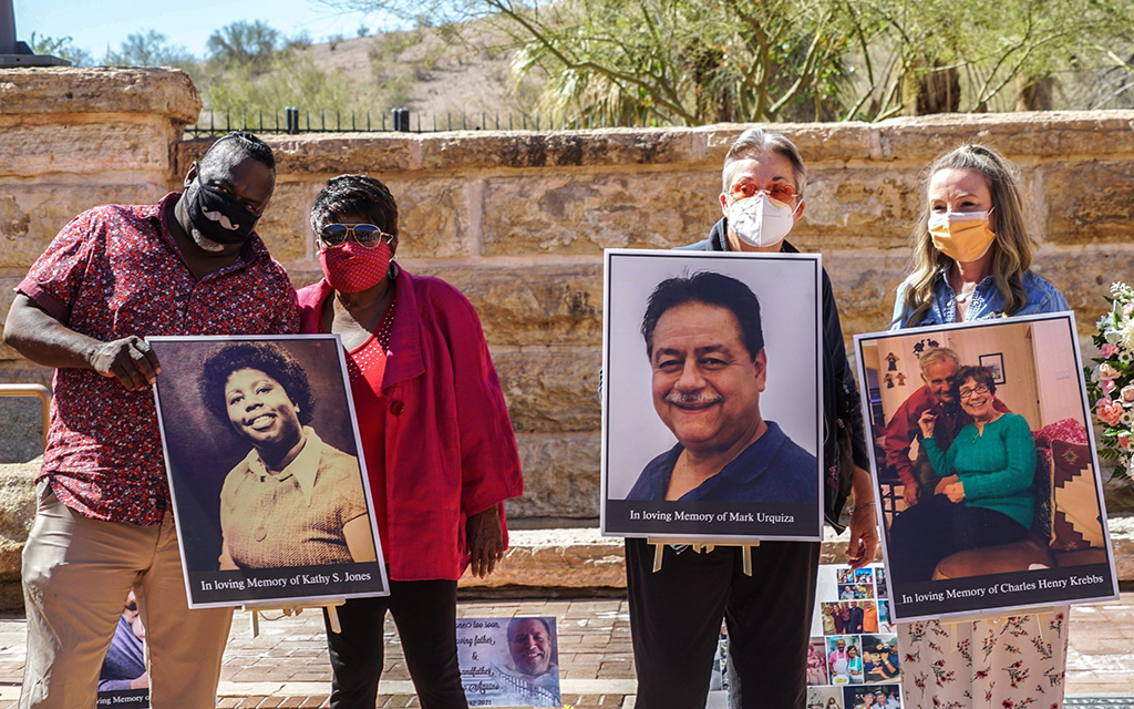 Todd Bailey, Joyce Bailey, Brenda Urquiza and Tara Kebbs, from left, gathered in March 2021 at the Arizona Heritage Center in Tempe to pay respects and honor the Arizonans who died from COVID-19. A Lancet study in March says Arizona recorded 581 deaths per 100,000 people – the highest rate in the U.S. (File photo by Sierra Bardfeld/Cronkite News)