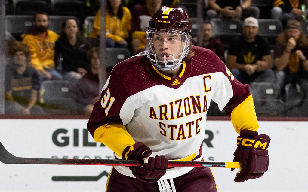 Josh Doan in gear for Arizona State University on the ice during a hockey game.