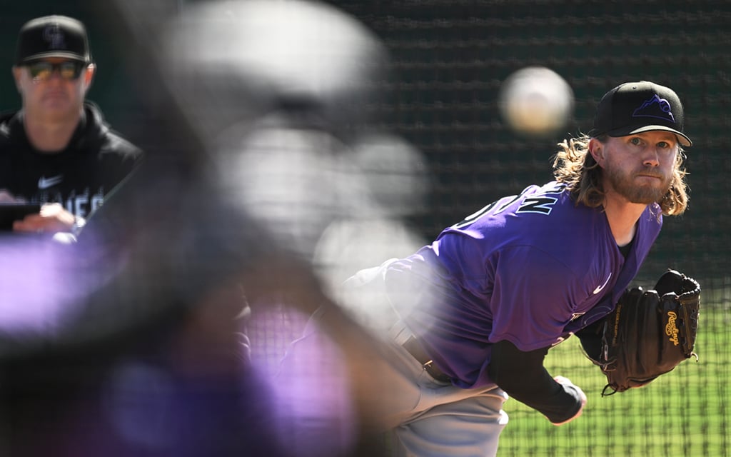 The Colorado Rockies' Pierce Johnson pitches a baseball.