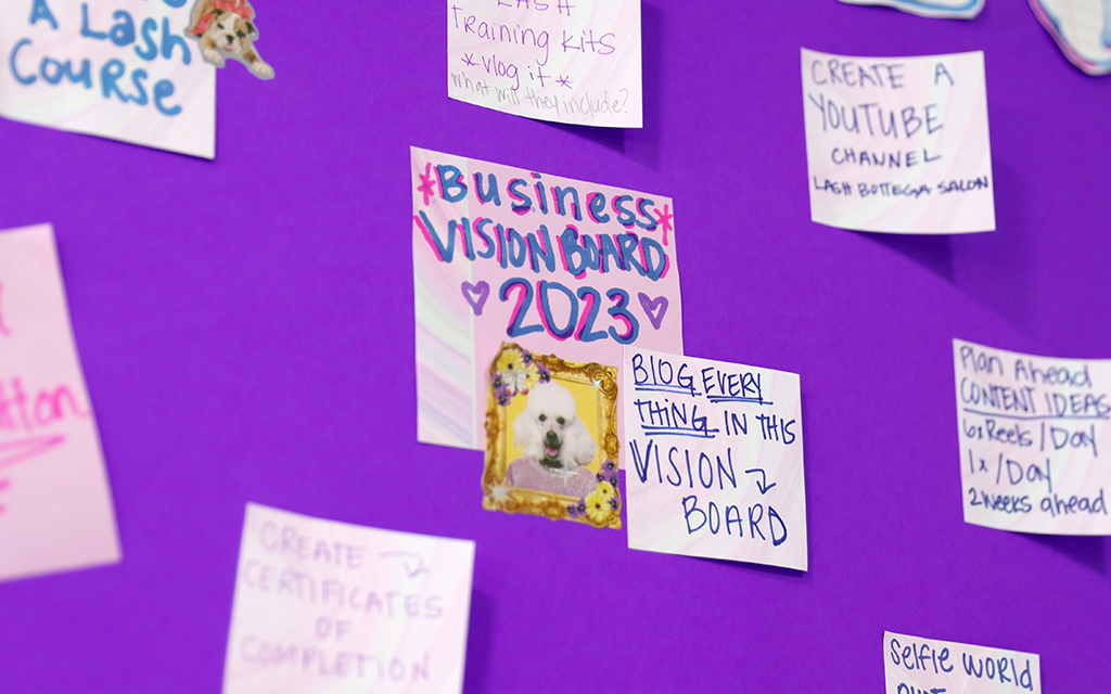 Raquel Solis' 2023 vision board for her Lash Bottega Salon eyelash business on March 13, 2023. Notes on the board describe Solis’ business goals for the year. (Photo by Izabella Hernandez/Cronkite News)