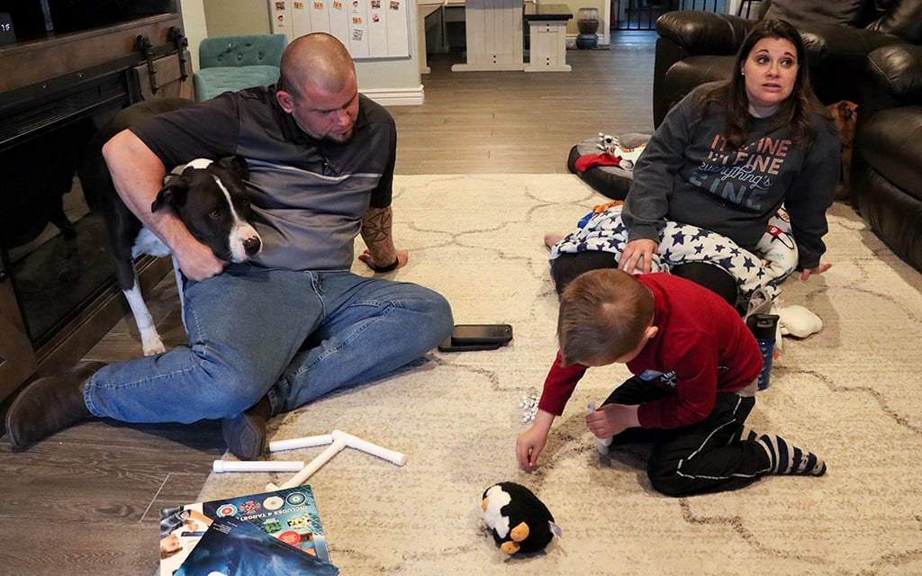 “We knew almost right away that there was something wrong within the first six hours of his birth,” Christine Buckrucker said about her 4-year-old son, Colton Buckrucker. Colton and his father, Chris, build a toy. Colton has a weakened immune system that’s led to several surgeries and medical procedures. (Photo by Sierra Alvarez/Cronkite News)