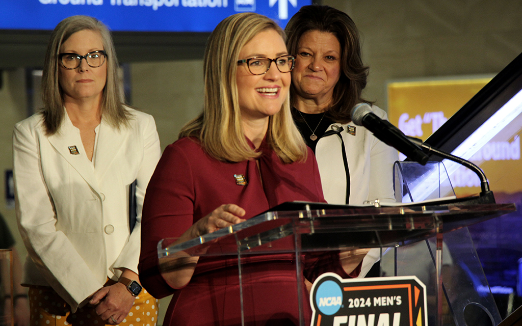 Phoenix Mayor Kate Gallego, center, flanked by Gov. Katie Hobbs, left, and JoAn Scott, the NCAA’s managing director of men’s basketball championships, shares her excitement about what the 2024 Final Four will mean for the Valley. (Photo by Robert Crompton/Cronkite News)
