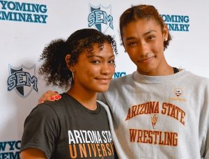 The lack of wrestling opportunities in the United States fueled Korina Blades, left, and Kennedy Blades to pursue competition overseas at a young age. (Photo courtesy of Kennedy and Korina Blades)