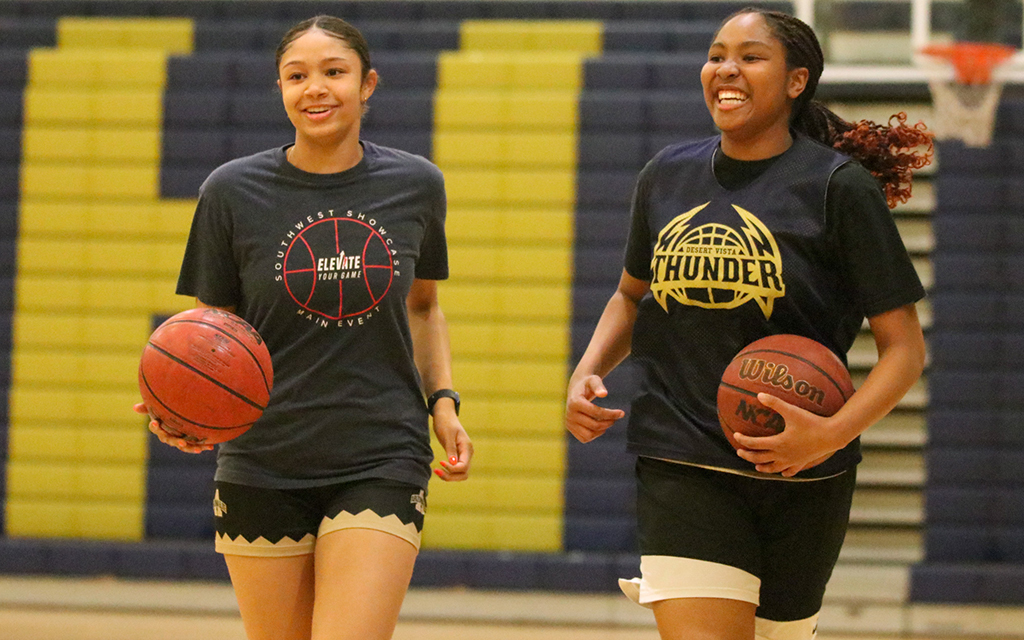 Desert Vista juniors Madison Brown, left, and Sydnie Taylor were all smiles in practice ahead of the State Champions Invitational Tournament last weekend. (Photo by Dylan Nichols/Cronkite News)