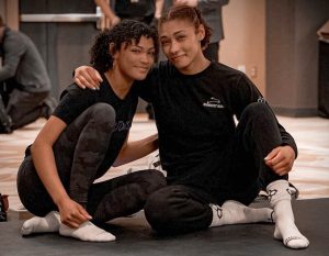Korina Blades, left, who is nursing a shoulder injury, has a high ceiling in wrestling like her older sister, Kennedy. The sister duo hopes to compete in the 2024 Olympics. (Photo courtesy of Kennedy and Korina Blades)