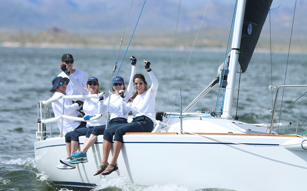 The Dreamline crew, captained by Joshua Newland, celebrates after finishing in first place Saturday at the 2023 Tall Cactus Regatta. (Photo by Brevin Monroe/Cronkite News)