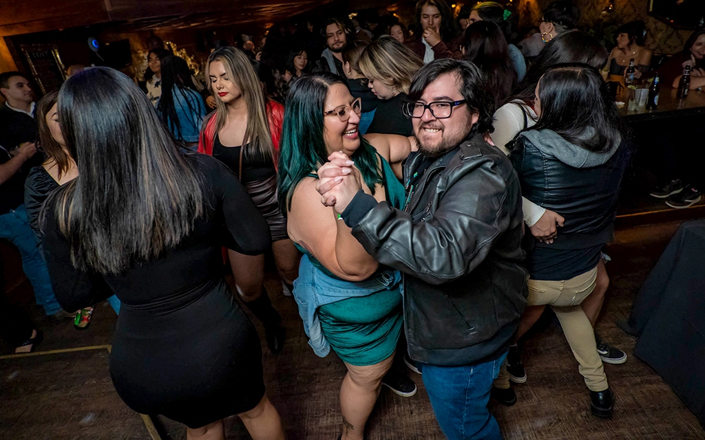 Crystal Jaramillo, left, and Steven Jaramillo let their feet lead them to the rhythm of cumbia music at The Womack in Phoenix on March 17, 2023. (Photo by Fernando Hernández)