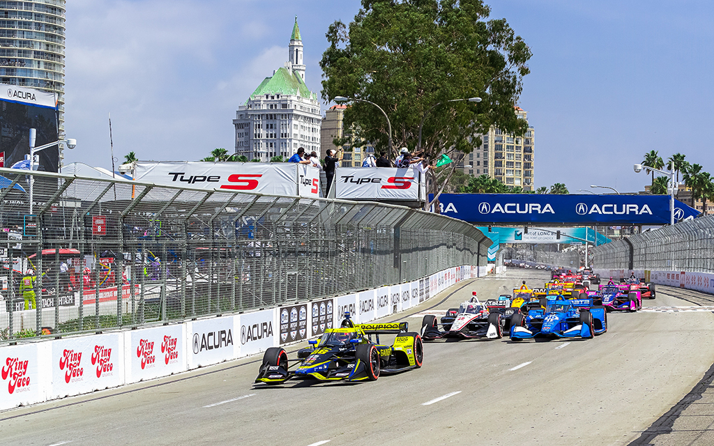 The Long Beach Grand Prix takes place in the shadow of the city’s downtown highrise buildings. Drivers can’t enjoy the scenery, however, as they work their way through a series of tight turns and high-speed straightaways. (Photo by John Bosma/GPALB)