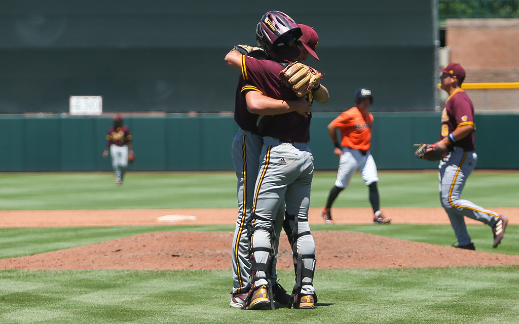 Arizona State's Owen Stevenson embraces catcher Bronson Balholm after closing out a must-win 14-10 victory over Oregon State in the Pac-12 Baseball Tournament at Scottsdale Stadium. (Photo by Joey Plishka/Cronkite News)