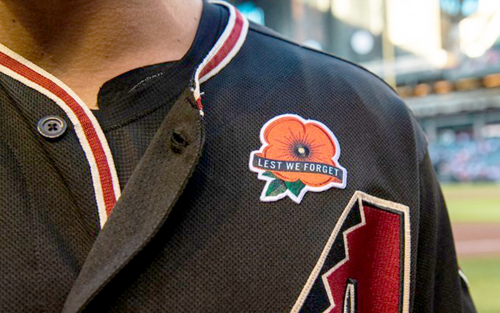 The Arizona Diamondbacks wore a traditional Memorial red poppy patch on the left side of their jersey with the message, “Lest We Forget.” (Photo courtesy of the Arizona Diamondbacks)