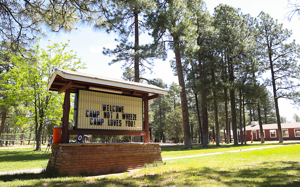 A sign welcomes campers to Camp Not-A-Wheeze in Heber, Arizona. The camp educates children ages 7 to 14 about asthma and how they can live normal lives despite their chronic lung disease. (Photo by Joey Plishka/Cronkite News)