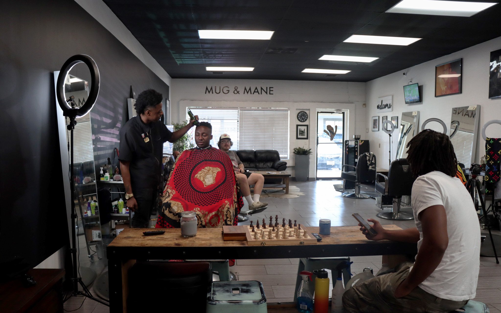 Mug and Mane Barber Lounge is one of Scottsdale's few Black-owned businesses. Owner Dre Brown has cut the hair of NBA star Jamal Murray and NFL star DK Metcalf, among other professional athletes and celebrities. (Photo by Bobby Murphy/Cronkite News)