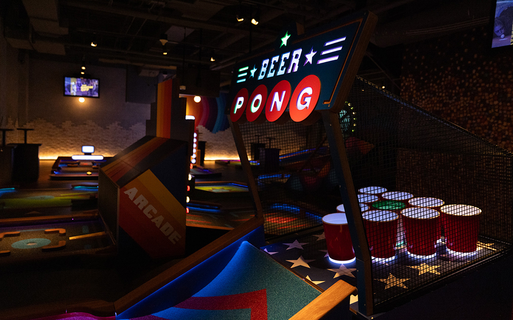 Golfers can "aim for one of 10 beer pong cups" while competing in mini golf, according to Puttshack's website. (Photo by Alyssa Polc/Cronkite News)