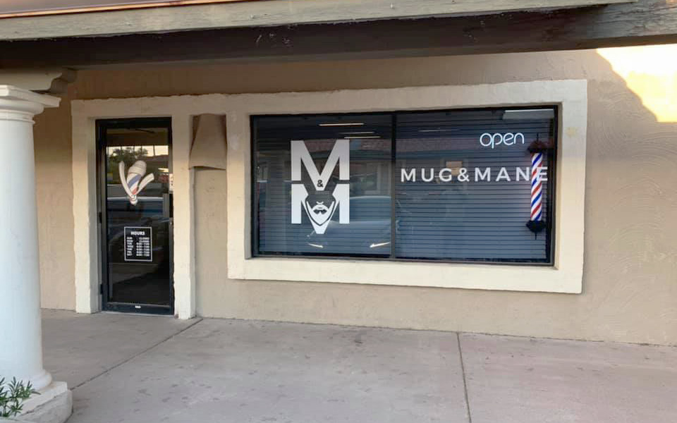 Mug and Mane Barber Lounge owner Dre Brown sold his jewelry, secured loans and saved money to open Mug and Mane Barber Lounge in July 2018. (Photo by Bobby Murphy/Cronkite News)