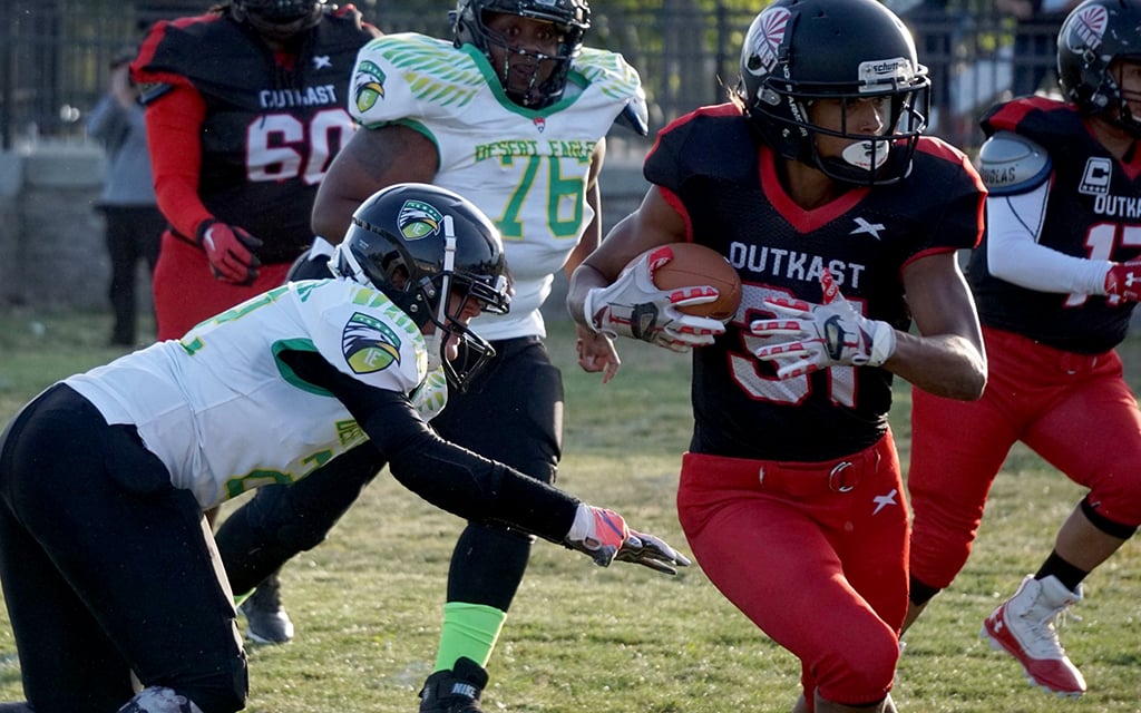 Arizona Outkast running back Jazmyne Reining works through the defenders with her eyes on the end zone. The Outcast is one of 30 teams in Division 3 of the Women's Football Alliance. (Photo courtesy of Sareli Utley)