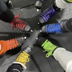 Players from the Arizona Legacy Pride Hockey Association are laced up and ready to go before a game. The league has four teams and 48 members. (Photo courtesy of ALPHA’s Instagram)
