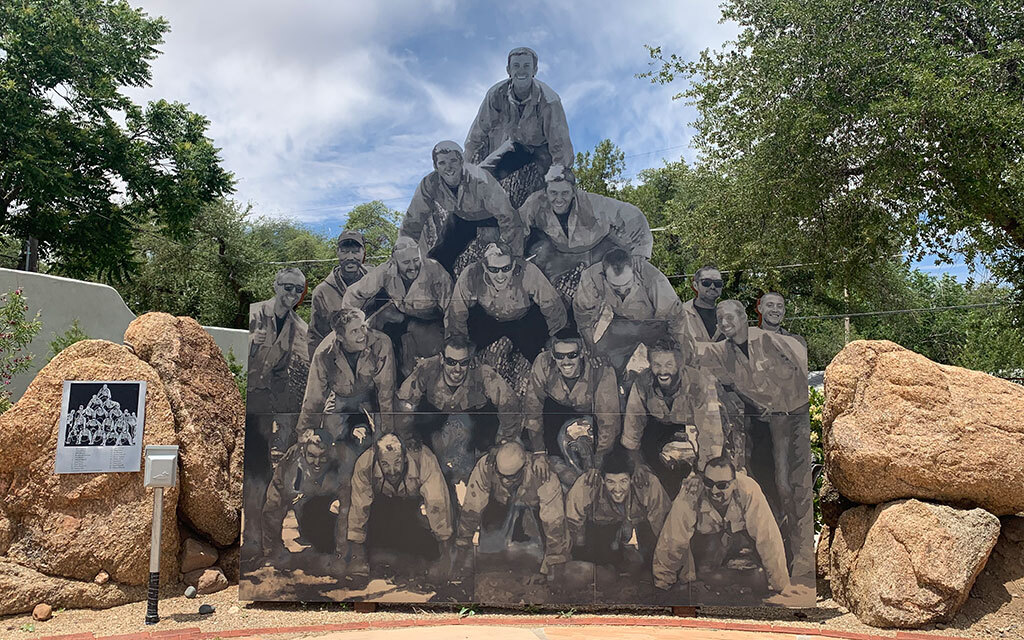 A photo of all 20 Granite Mountain Hotshots posing in a human pyramid was turned into a statue at the Yarnell Hill Fire Memorial. (Photo by Sean Lynch/Cronkite News)