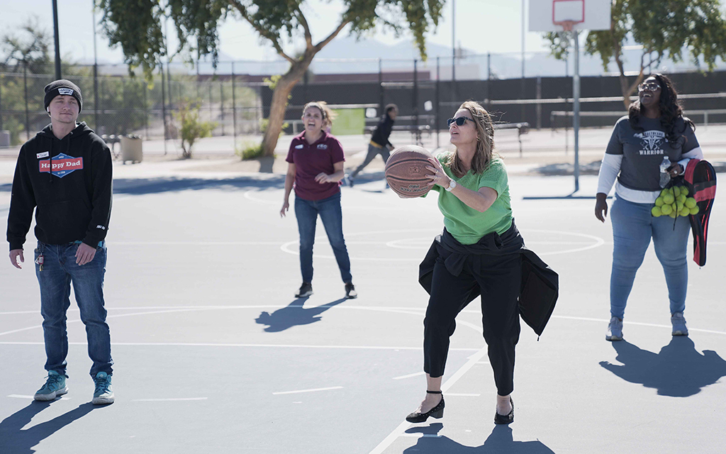 Valleywise Health’s First Episode Center staff enjoys a game of basketball with patients at their fall festival. (Photo courtesy of Valleywise Health)