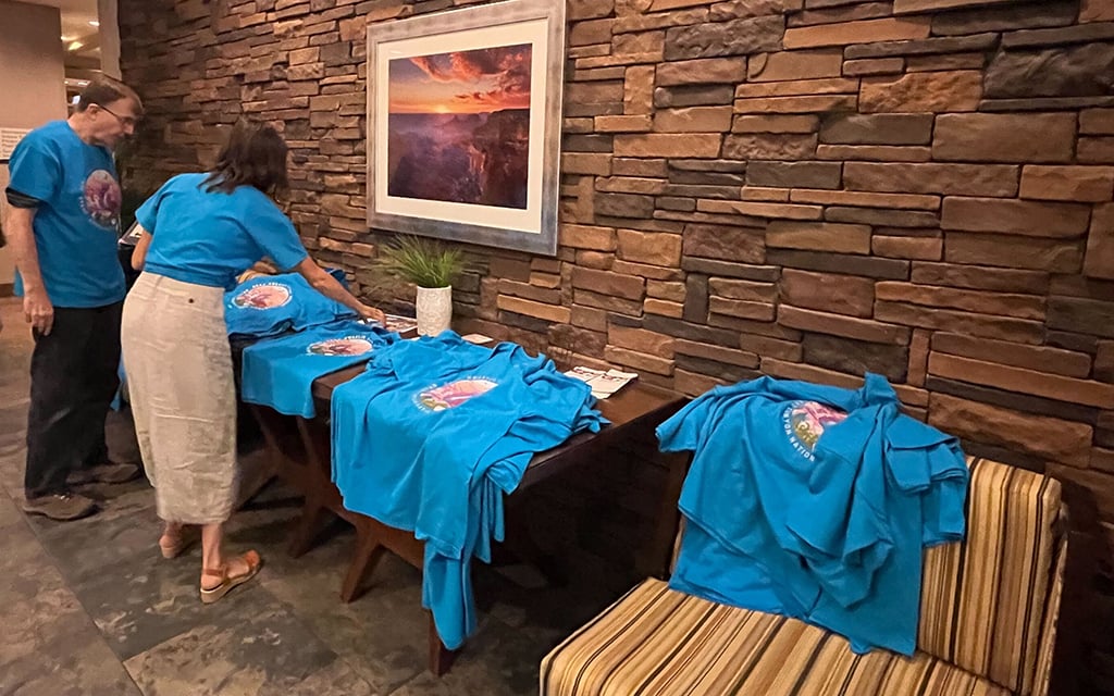 Many people wore matching blue T-shirts that read “Baaj Nwaavjo I’tah Kukveni Grand Canyon National Monument '' to a public meeting to discuss the proposed national monument near the Grand Canyon. (Photo by Ashley Lay/Cronkite News)
