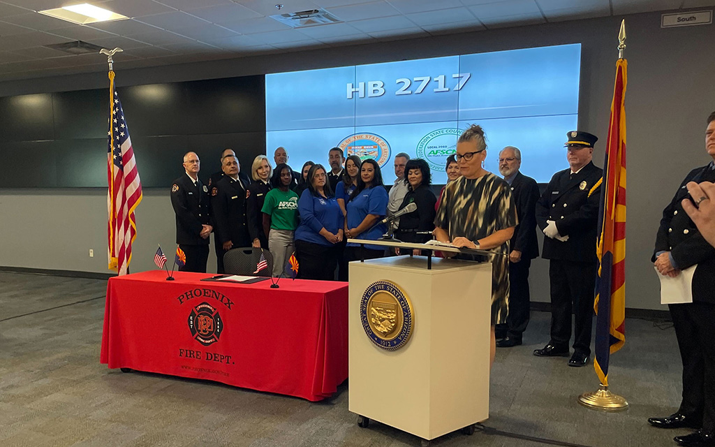 Arizona Gov. Katie Hobbs celebrates a bill ofafering trauma therapy to 911 dispatchers on Aug.23, 2023, at the Phoenix Fire Department’s 911 regional dispatch center. (Photo by Cameron Arcand/Cronkite News)