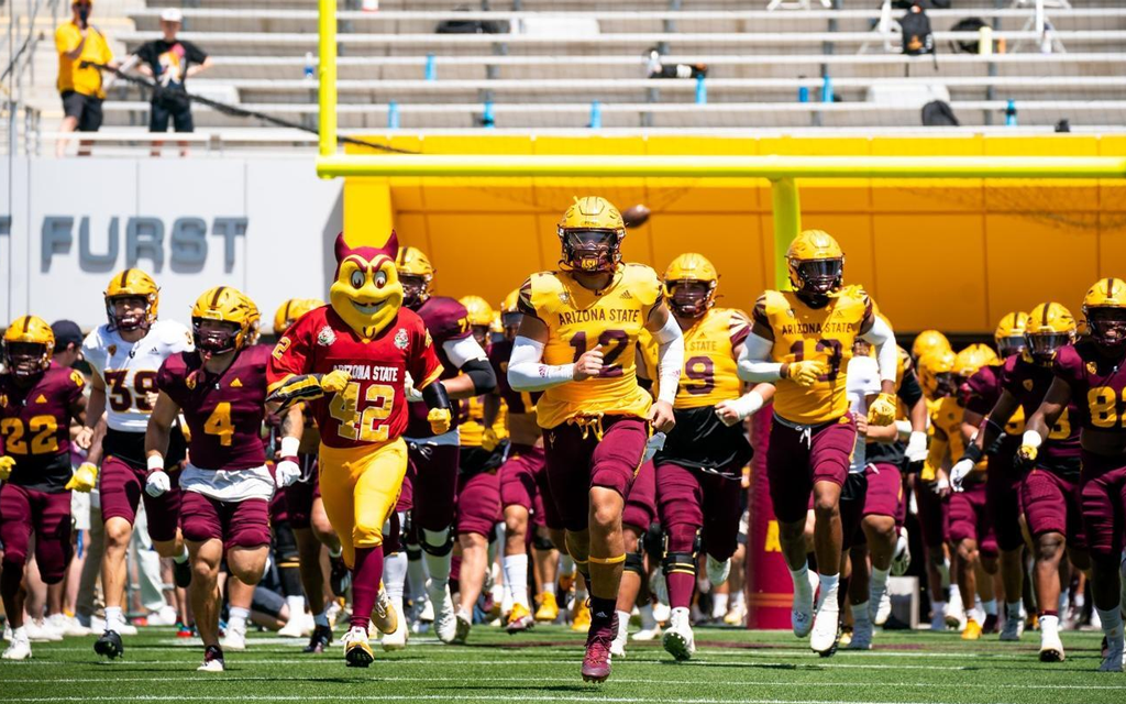 ASU football team runs out on field with Sparky during Spring game
