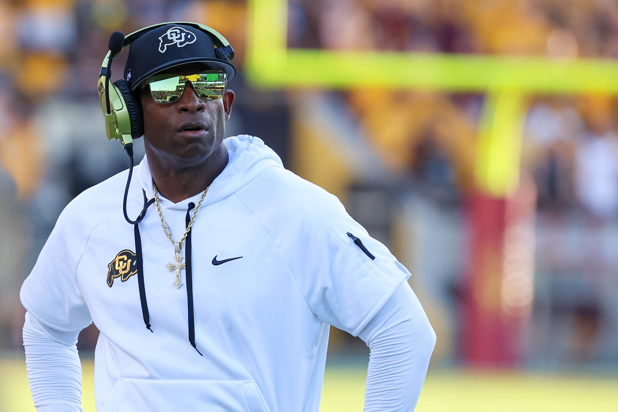Colorado football coach Deion Sanders looks at the scoreboard during a game against ASU at Mountain America Stadium in Tempe on Oct. 7, 2023. (Photo by Reece Andrews/Cronkite News)
