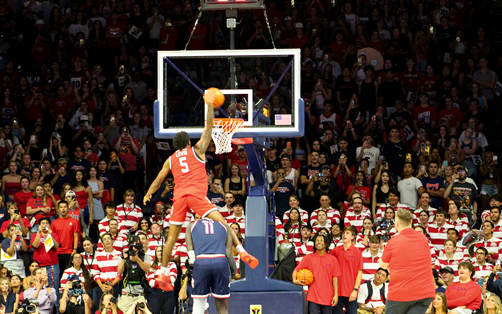 KJ Lewis leaping over teammate in dunk contest.