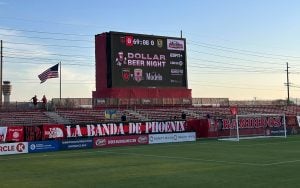 The banners that Los Bandidos have created hang in the south end of Phoenix Rising Stadium. (Photo by Dylan Ackermann/Cronkite News)