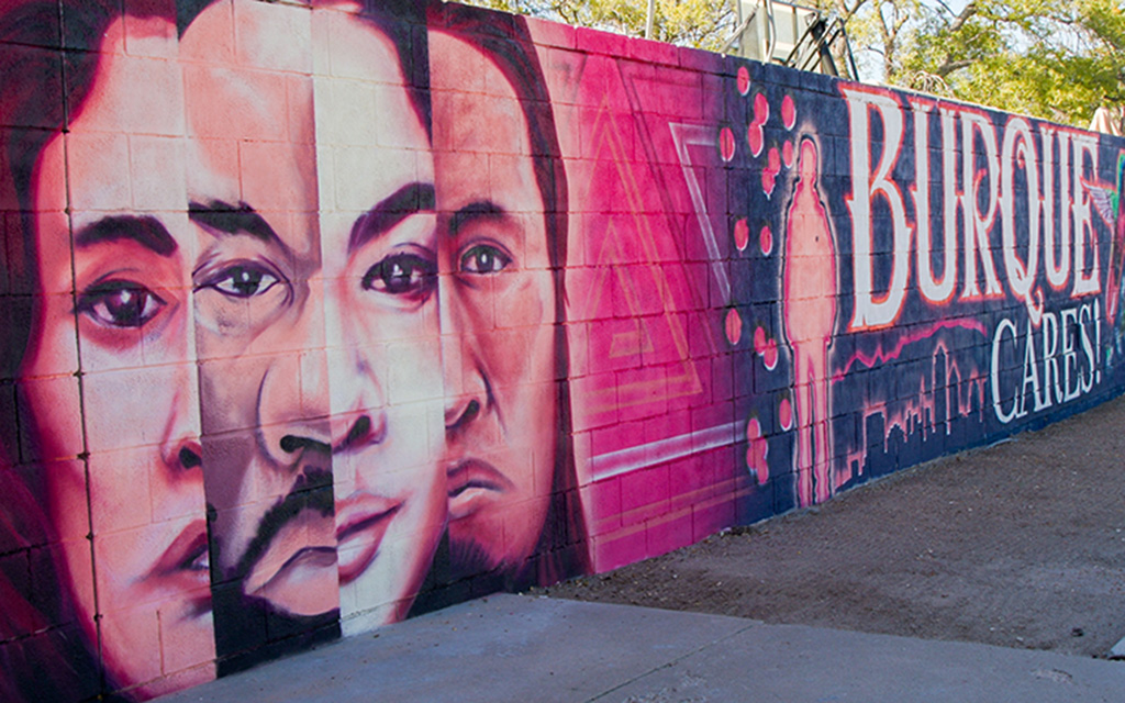 New Mexicans to Prevent Gun Violence unveiled a new mural outside San Pedro Library in Albuquerque on Nov. 4, 2023. When viewed through a phone camera, the mural comes to life and names appear thanks to augmented reality technology. (Photo by John Leos/Cronkite News)