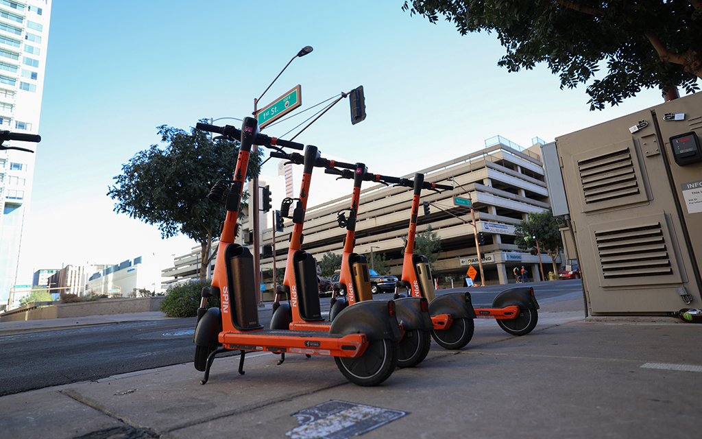 Scooters are parked on the corner of East First Street and Monroe Street in Phoenix on Nov. 13, 2023. (Photo by Sam Volante/Cronkite News)