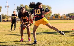 Flag football coaches strategize for the upcoming season, discussing plans to add more girl's teams and target junior high schools to ensure the sport's continued growth. (File photo by Susan Wong/Cronkite News)
