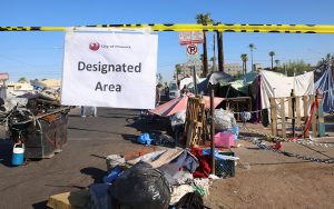 Phoenix city workers close areas of The Zone block by block, designating areas for “enhanced engagements” to clear the streets of what was once one of the largest homeless encampments in the U. S. (Photo by John Leos/Cronkite News)