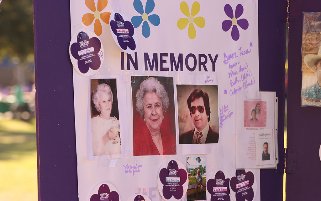 Pictures of relatives lost to Alzhemer’s disease were posted on a memorial at the annual Walk to End Alzheimer’s in Laredo, Texas, on Nov. 4. (Photo by Angelina Steel/Cronkite News)