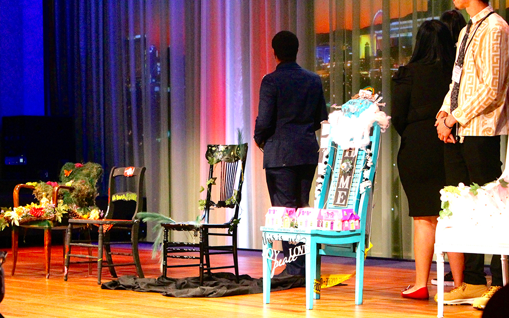 Youth who have experienced homelessness showcase their art project, “Pull Up a Chair,” at the Nevada Youth Homelessness Summit in Las Vegas on Nov. 8. (Photo by Oakley Seiter/Cronkite News)
