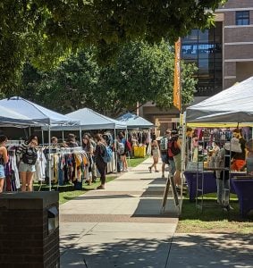 Students at Arizona State University’s West Valley Campus browse the vendors at University Street Market. “They’re the perfect age group to sell the clothes to because they’re more into fashion,” says Eddie Pan, who created the market. (Photo by Kate Duffy/Cronkite News)