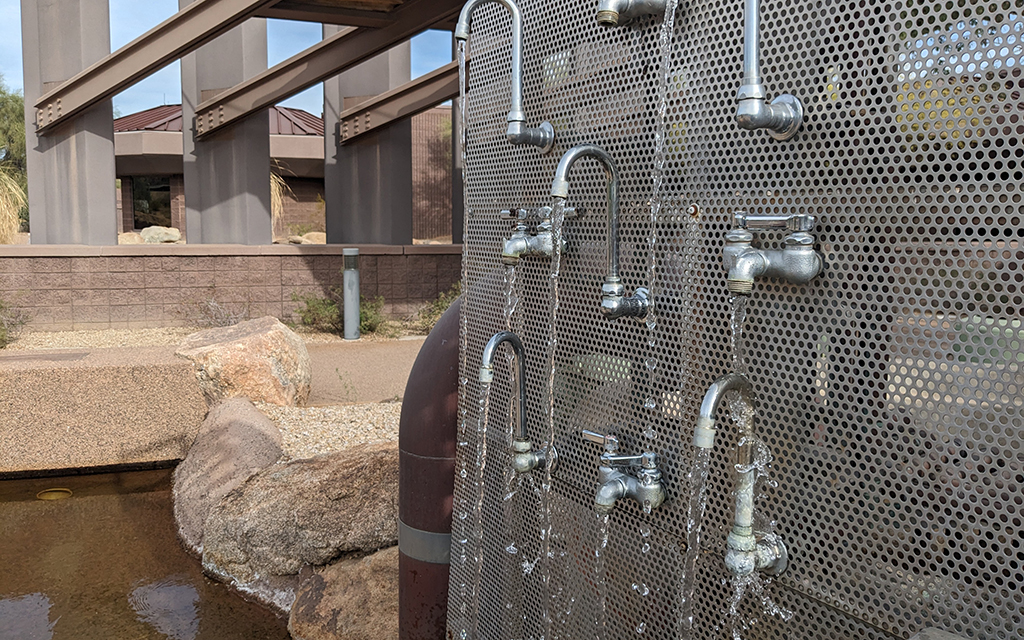 Water drips from faucets at an artistic reclaimed water display in front of the Scottsdale Water Campus. (Photo by Kate Duffy/Cronkite News)