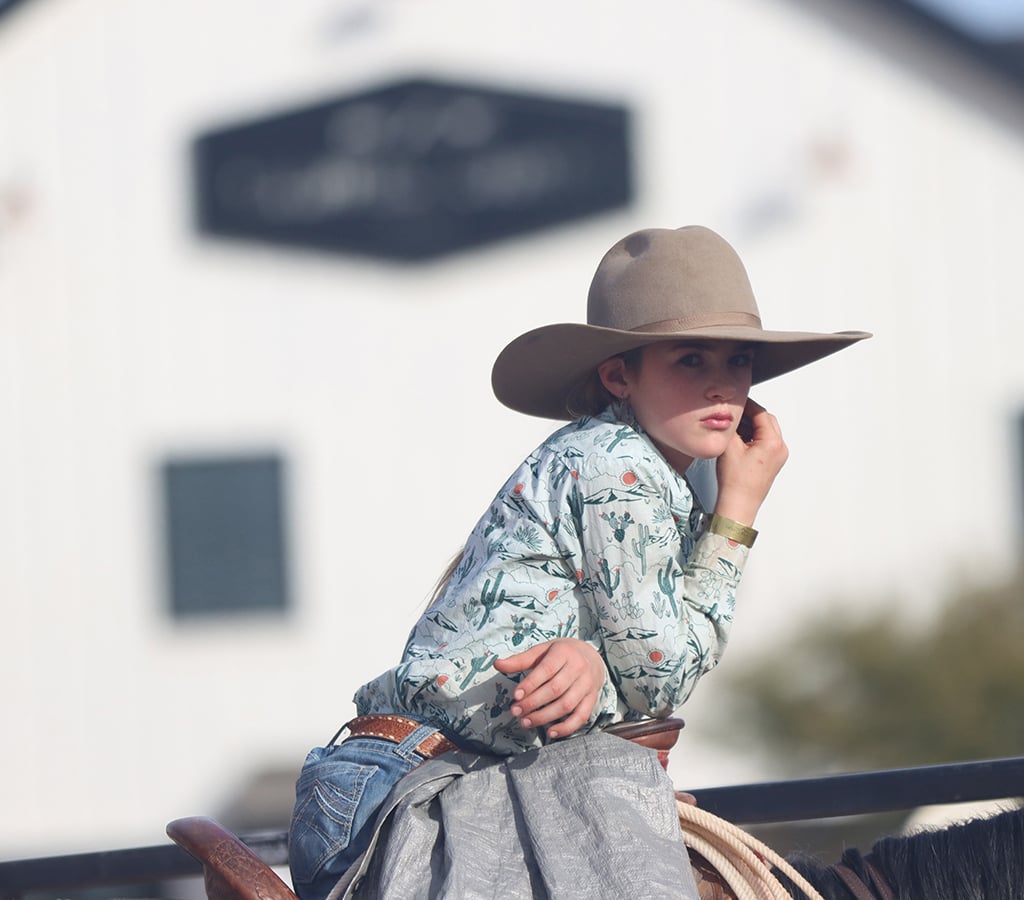 Haddie Clark, 12, rides her horse at the Art of the Cowgirl on Jan. 19, 2024. Haddie’s mother, Reata Clark, with Clark Ranch Horses & Performance Prospects, was introduced to Art of the Cowgirl by a friend and has attended the event ever since. She says that it’s the livelihood and womanhood of Art of the Cowgirl that makes people connect with the event. (Photo by Mariah Temprendola/Cronkite News)
