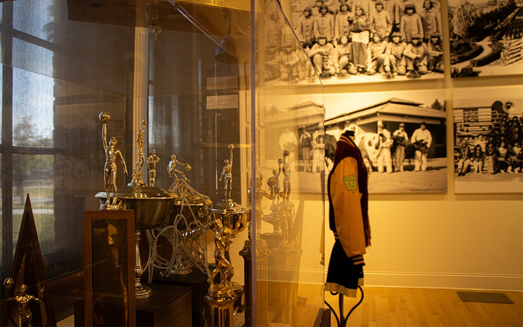Trophies, a letterman jacket and images of early Native American history in the visitor center of Phoenix Indian School at what is now Steele Indian School Park. (Photo by Ellie Willard/Cronkite News)
