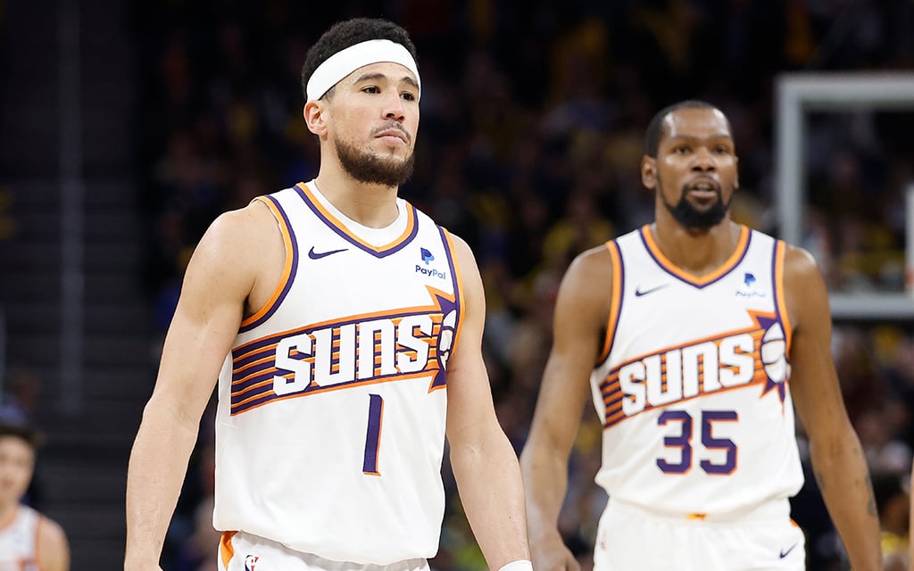 In the second half of the NBA season, Devin Booker, left, and Kevin Durant face a pivotal period where the Phoenix Suns aim to solidify their playoff positioning and make a championship push. (Photo by Lachlan Cunningham/Getty Images)