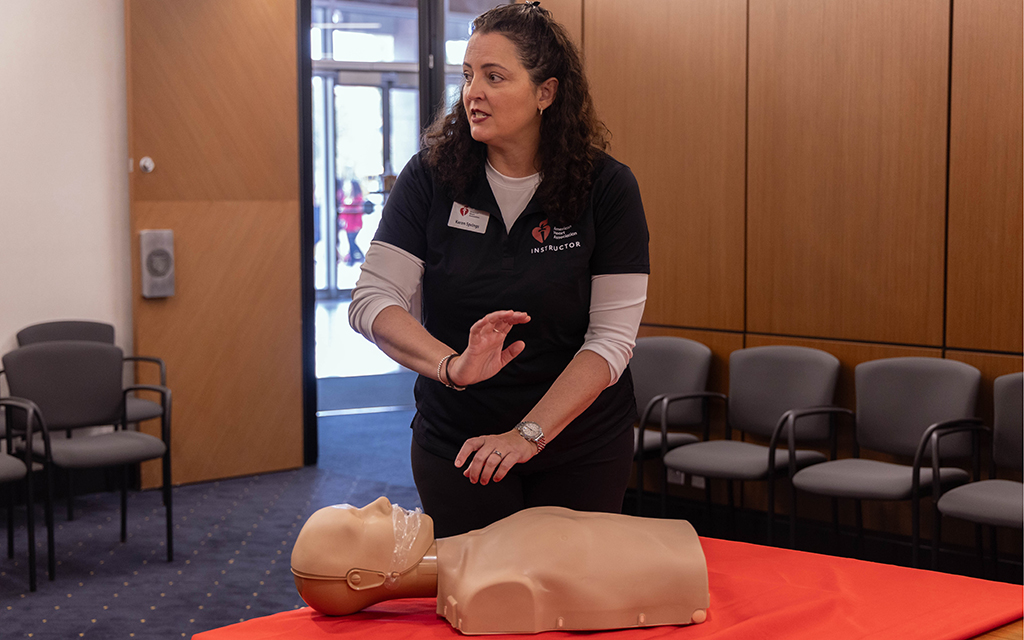 American Heart Association instructor Karen Springs demonstrates how to perform CPR while at the Arizona Capitol on Feb. 7, 2024, for the Arizona Heart Association’s annual lobby day. (Photo by Sam Ballesteros/Cronkite News)