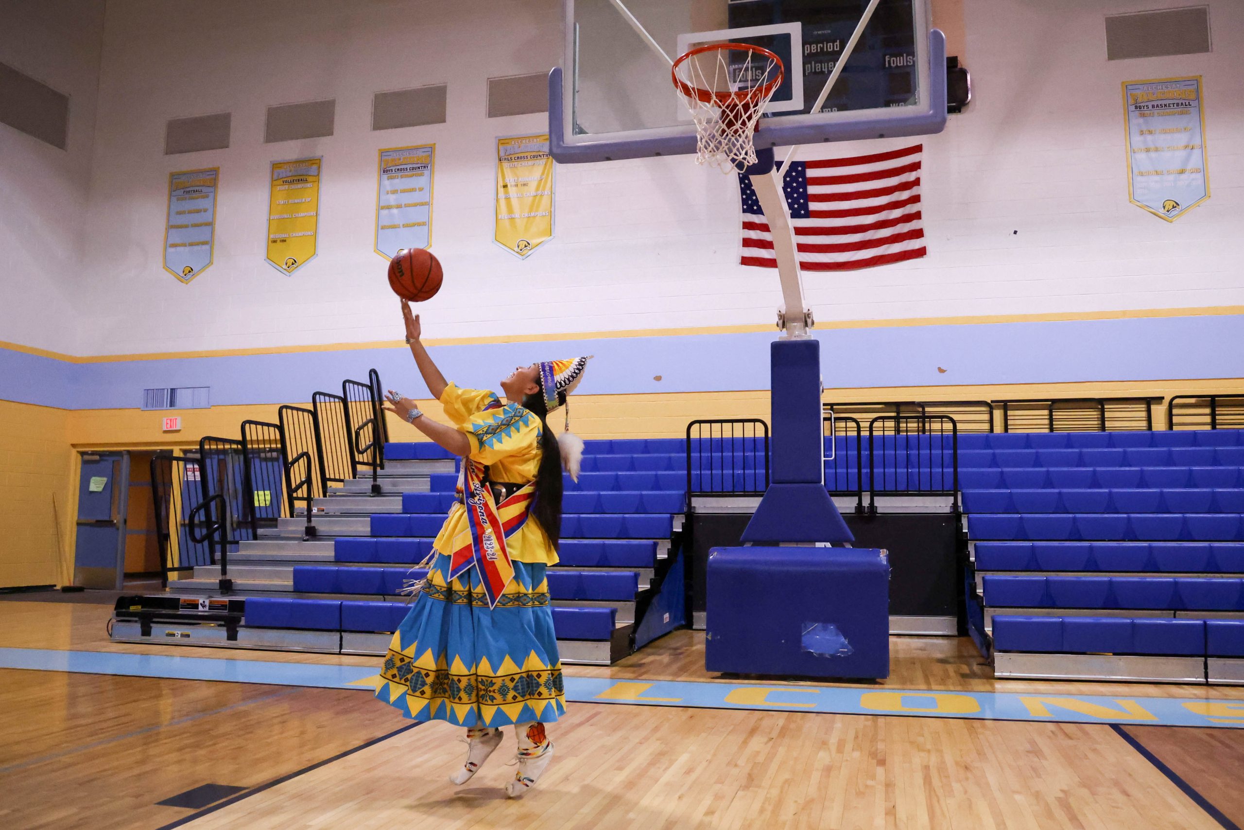 Laney Lupe, an Alchesay girls basketball alum and Miss Indian Arizona 2023-24, shoots a reverse layup at Chief Alchesay Activity Center in Whiteriver. (Photo by Reece Andrews/Cronkite News)
