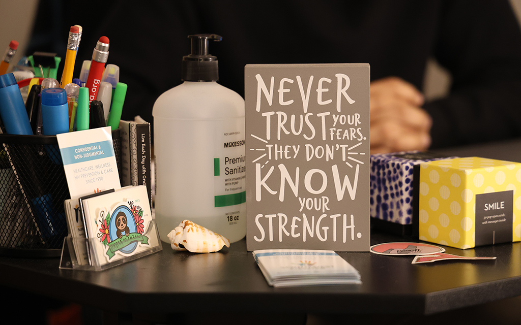 An encouraging slogan on the desk of Christopher Carrillo, case manager at the Southwest Center for HIV/AIDS in Phoenix. He spoke about being tested and treated for HIV and the affirmations that have helped him. (Photo by Jack Orleans/Cronkite News)
