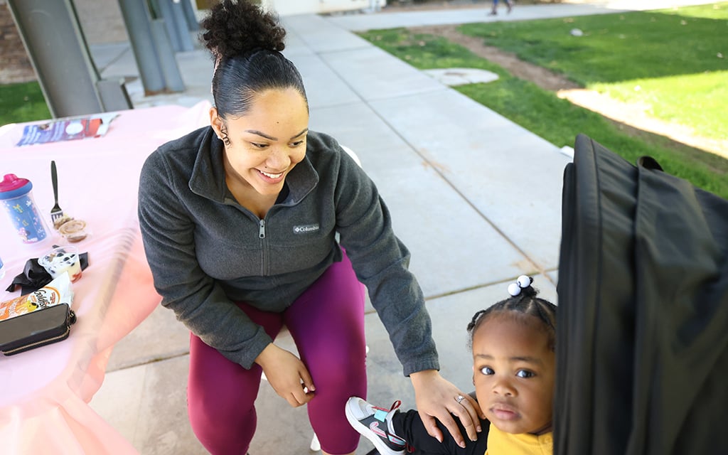 Umaja Isaiah, a Healthy Mama Festival attendee, is expecting her third child. (Photo by Jack Orleans/Cronkite News)